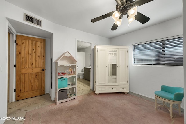 901 W Las Lomitas Rd, Tucson, AZ 85704 - bedroom with light tile patterned floors, a ceiling fan, and ensuite bathroom