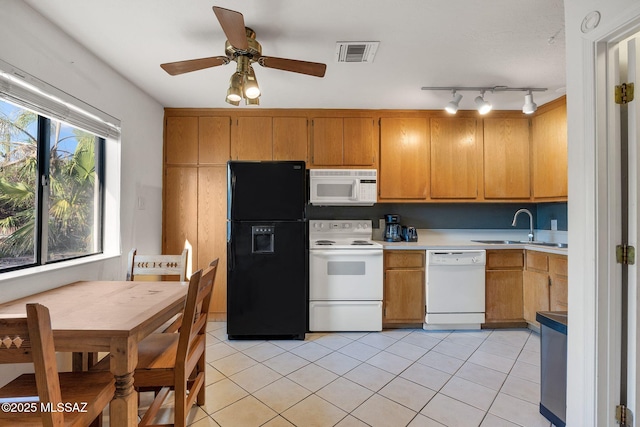 901 W Las Lomitas Rd, Tucson, AZ 85704 - kitchen with white appliances, light countertops, light tile patterned floors, and a ceiling fan