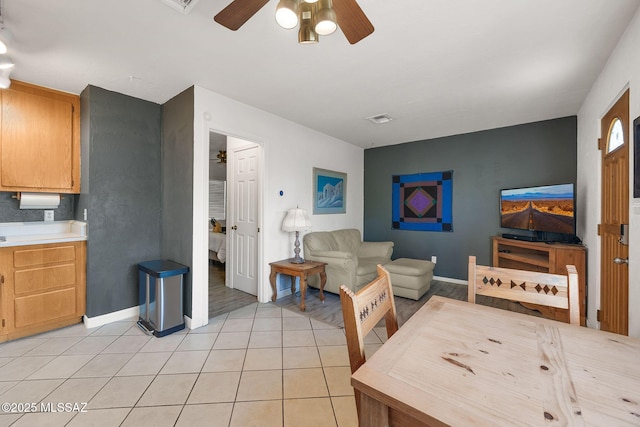 901 W Las Lomitas Rd, Tucson, AZ 85704 - living area featuring a ceiling fan and light tile patterned flooring