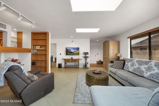 901 W Las Lomitas Rd, Tucson, AZ 85704 - living room featuring a skylight, light tile patterned floors, and track lighting