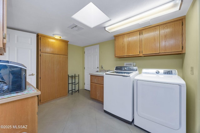 901 W Las Lomitas Rd, Tucson, AZ 85704 - laundry room featuring cabinet space, washer and dryer, a skylight, and light tile patterned floors