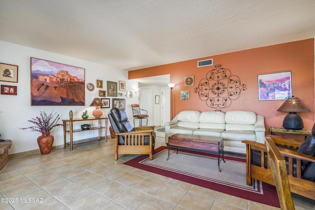 living area featuring visible vents and light tile patterned floors