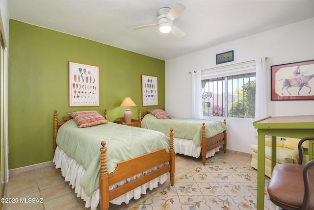 bedroom with light tile patterned flooring and a ceiling fan