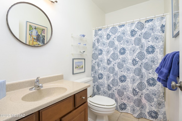 bathroom featuring tile patterned flooring, toilet, vanity, and a shower with shower curtain