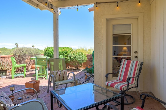 view of patio / terrace with a fire pit and fence