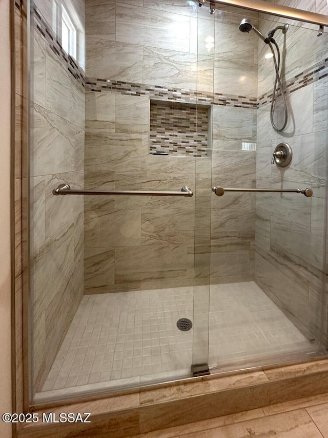 bathroom featuring a shower stall