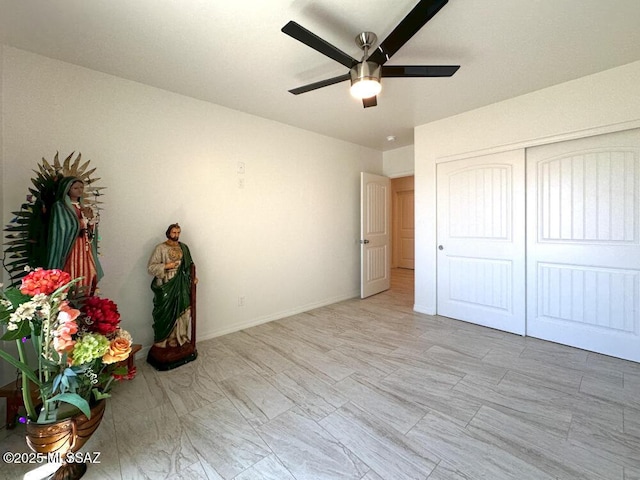 unfurnished bedroom with a closet and ceiling fan