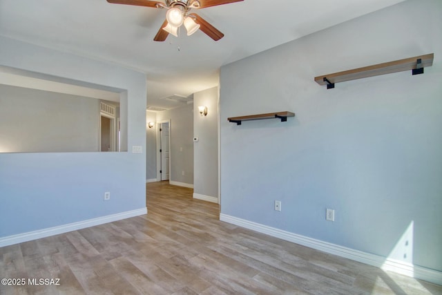 unfurnished room with baseboards and ceiling fan
