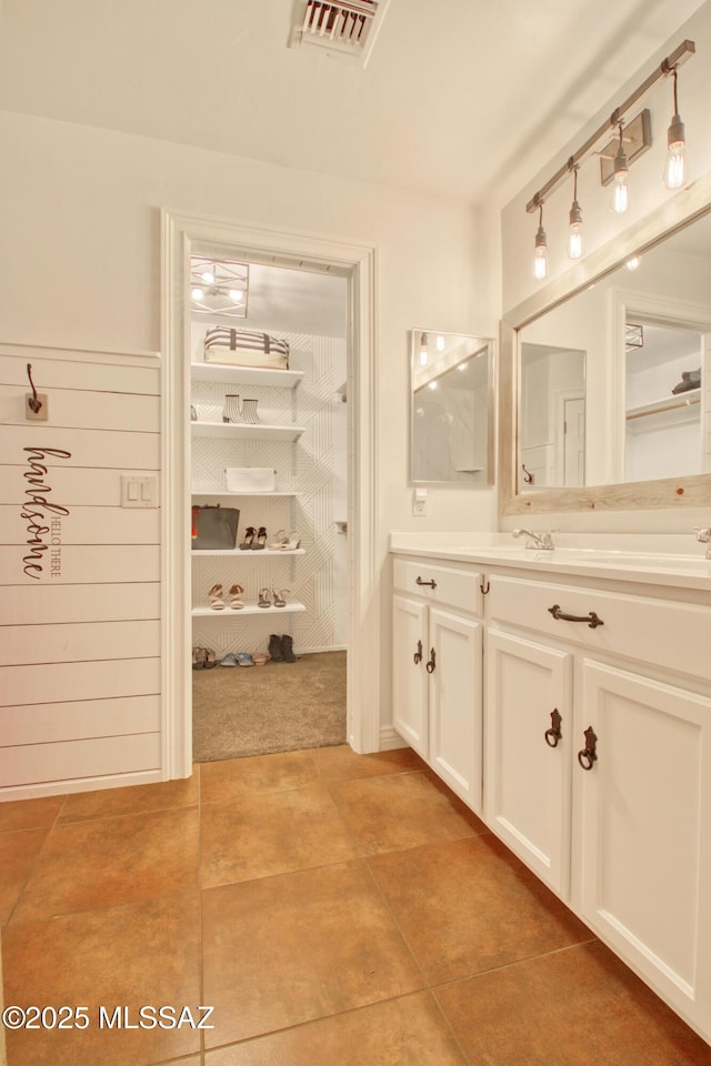 bathroom featuring tile patterned floors, visible vents, and vanity
