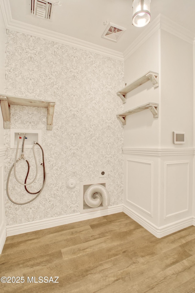 washroom featuring visible vents, hookup for a washing machine, laundry area, and light wood-style floors