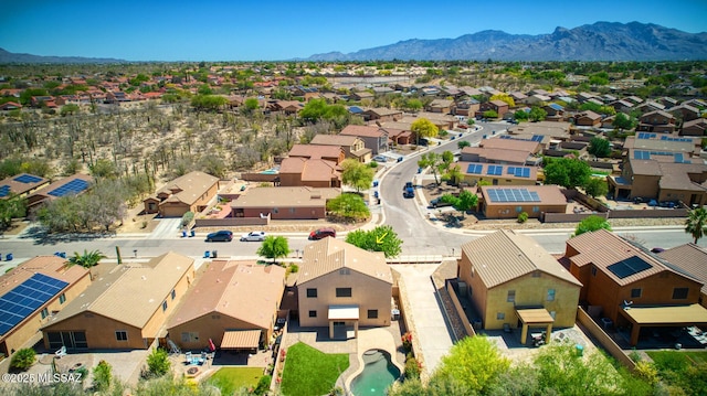 birds eye view of property featuring a mountain view and a residential view