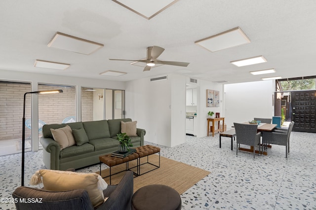 5701 E Glenn St Unit 57, Tucson, AZ 85712 - living room featuring a ceiling fan and visible vents