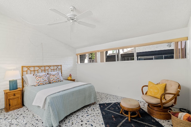 5701 E Glenn St Unit 57, Tucson, AZ 85712 - bedroom featuring a ceiling fan, a textured ceiling, and vaulted ceiling