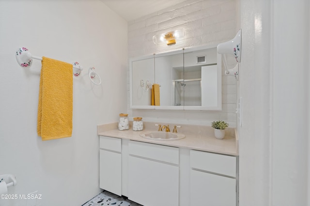 5701 E Glenn St Unit 57, Tucson, AZ 85712 - bathroom featuring an enclosed shower, visible vents, and vanity