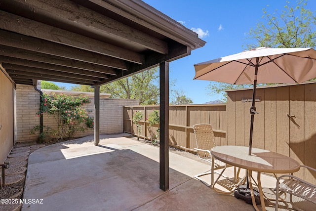 5701 E Glenn St Unit 57, Tucson, AZ 85712 - view of patio / terrace with a fenced backyard
