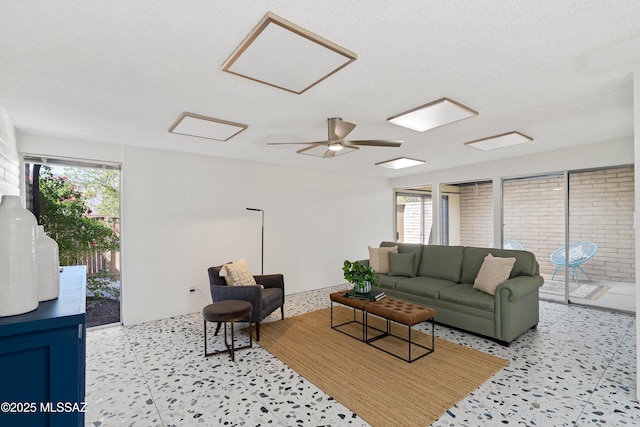5701 E Glenn St Unit 57, Tucson, AZ 85712 - living room featuring plenty of natural light and attic access