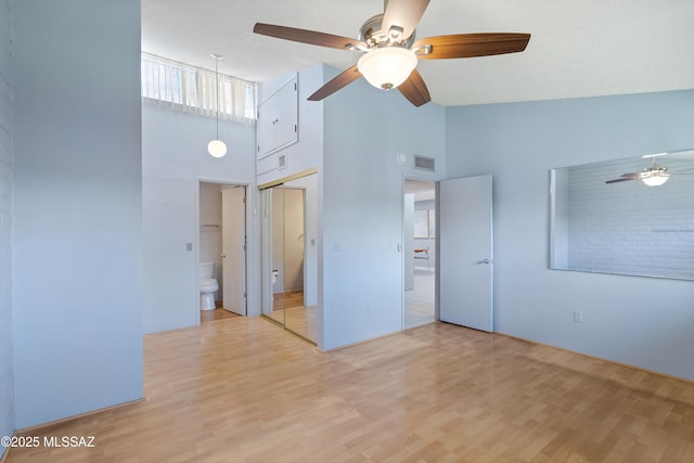 5701 E Glenn St Unit 61, Tucson, AZ 85712 - empty room with high vaulted ceiling, visible vents, ceiling fan, and light wood finished floors