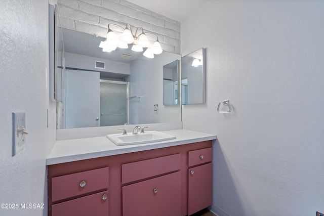 5701 E Glenn St Unit 61, Tucson, AZ 85712 - bathroom featuring visible vents, a stall shower, and vanity