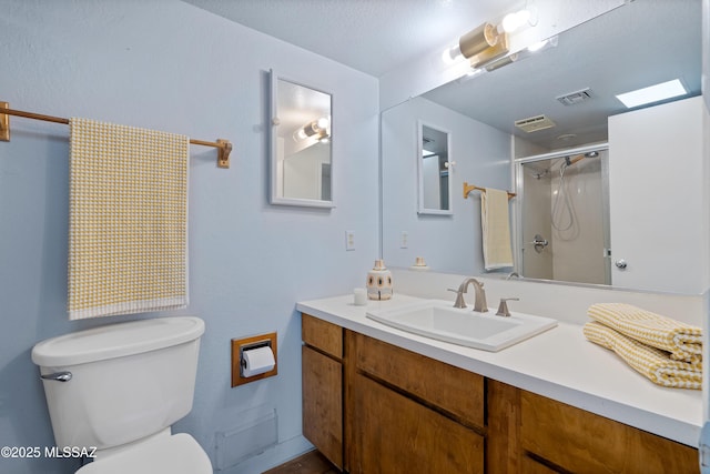 5701 E Glenn St Unit 61, Tucson, AZ 85712 - bathroom featuring toilet, visible vents, a shower stall, and vanity