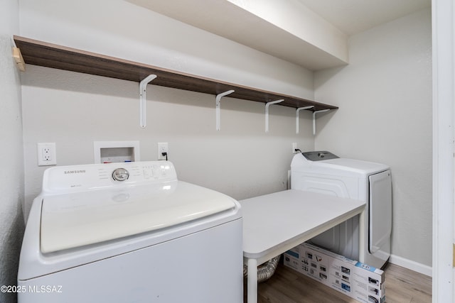 6624 N Galaxy Rd, Tucson, AZ 85741 - clothes washing area with washer and clothes dryer, light wood finished floors, and laundry area