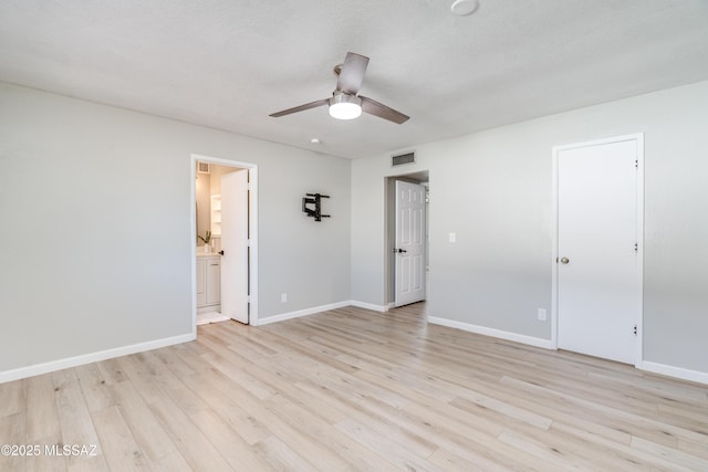 6624 N Galaxy Rd, Tucson, AZ 85741 - unfurnished bedroom with a ceiling fan, ensuite bathroom, light wood-style floors, baseboards, and visible vents