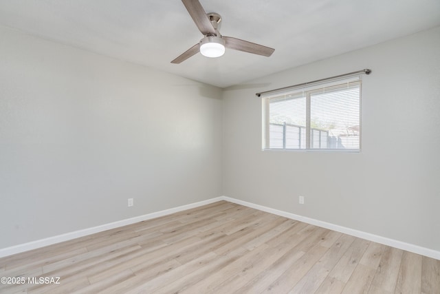6624 N Galaxy Rd, Tucson, AZ 85741 - empty room with wood finished floors, a ceiling fan, and baseboards
