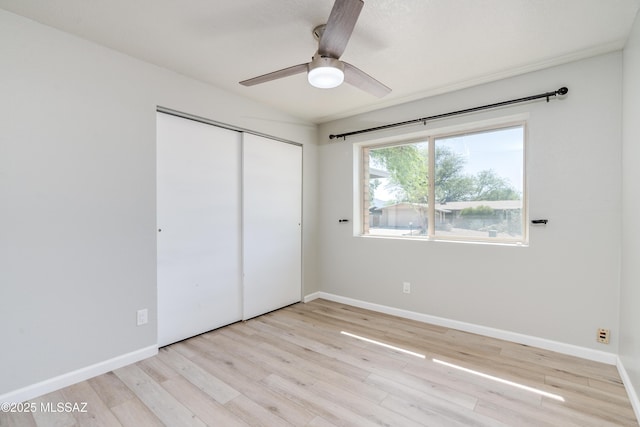 6624 N Galaxy Rd, Tucson, AZ 85741 - unfurnished bedroom with wood finished floors, a closet, and baseboards