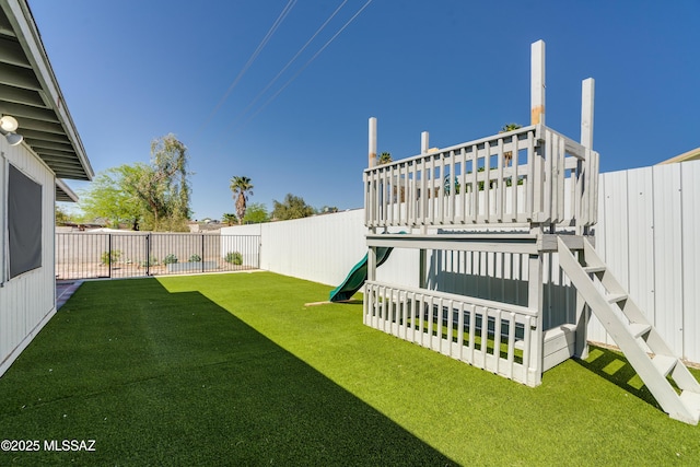 6624 N Galaxy Rd, Tucson, AZ 85741 - view of yard with a fenced backyard and a playground