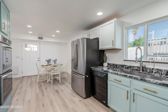6624 N Galaxy Rd, Tucson, AZ 85741 - kitchen featuring stainless steel appliances, visible vents, a sink, and light wood-style floors