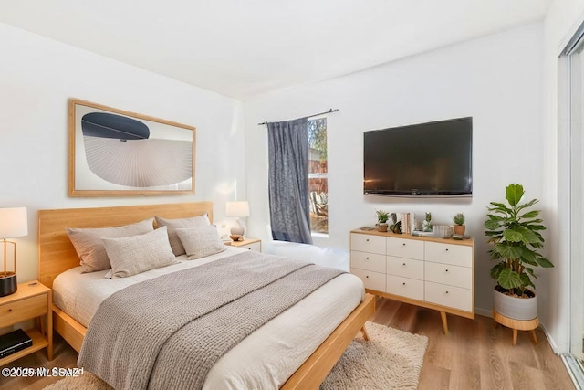 bedroom with wood finished floors