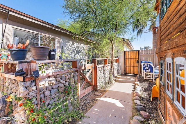 exterior space featuring fence and a gate