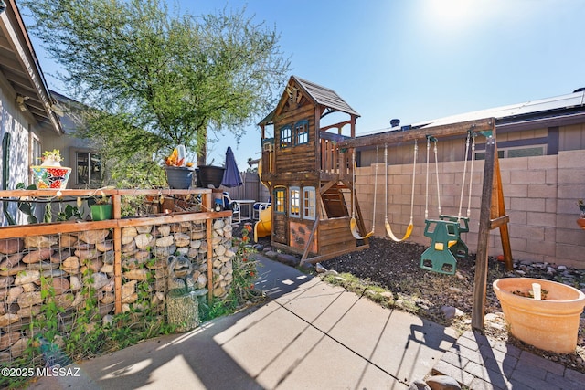 view of jungle gym featuring a fenced backyard