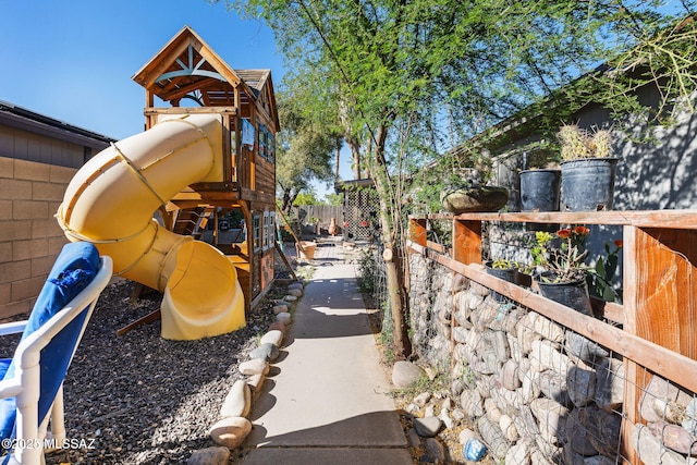 view of jungle gym with fence