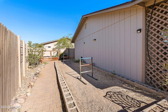 view of side of home with fence