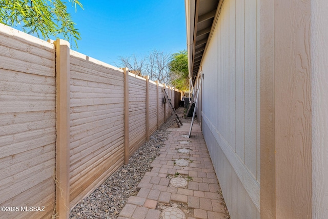 view of property exterior with a fenced backyard