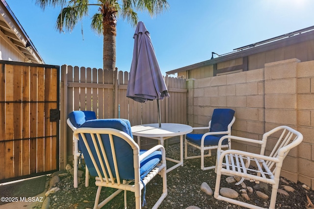 view of patio / terrace featuring fence