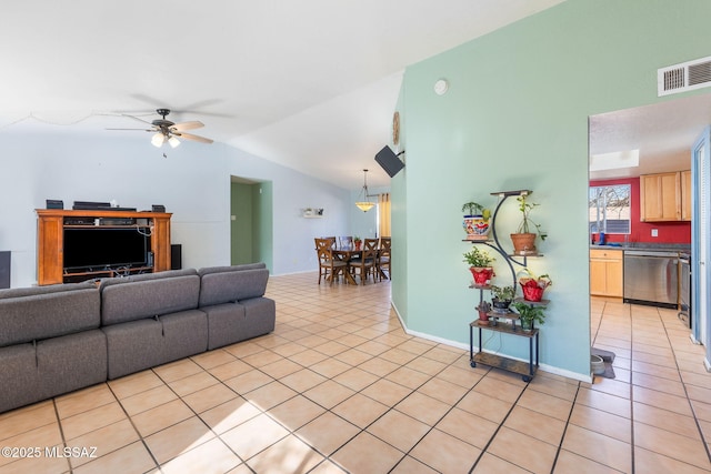 living area with lofted ceiling, ceiling fan, visible vents, and light tile patterned floors