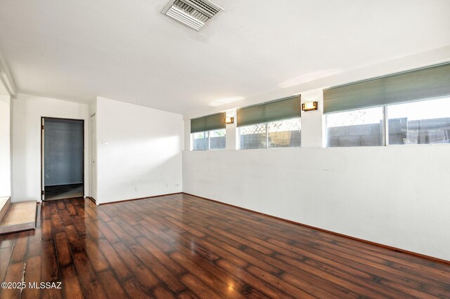 2245 N Northway Ave, Tucson, AZ 85716 - unfurnished room with baseboards, visible vents, and hardwood / wood-style flooring