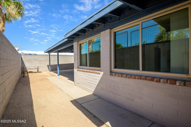 2245 N Northway Ave, Tucson, AZ 85716 - view of side of home featuring fence and a patio