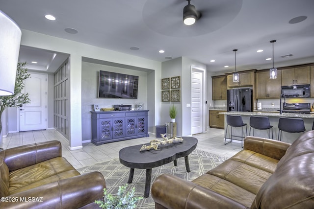 5854 W Indian Sunrise Dr, Tucson, AZ 85742 - living room featuring recessed lighting, a ceiling fan, baseboards, and visible vents
