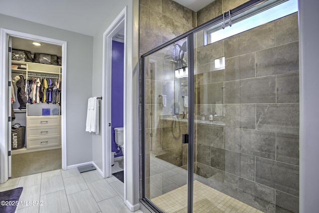 5854 W Indian Sunrise Dr, Tucson, AZ 85742 - full bath featuring toilet, baseboards, a spacious closet, and a shower stall
