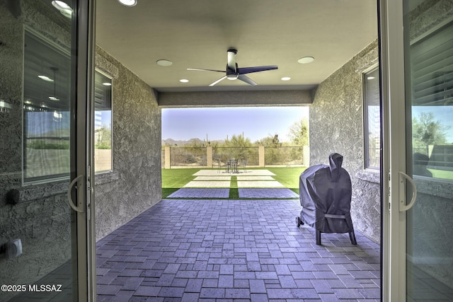 5854 W Indian Sunrise Dr, Tucson, AZ 85742 - view of patio / terrace with ceiling fan and fence