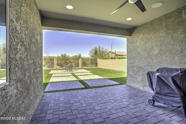 5854 W Indian Sunrise Dr, Tucson, AZ 85742 - view of patio with a fenced backyard and ceiling fan