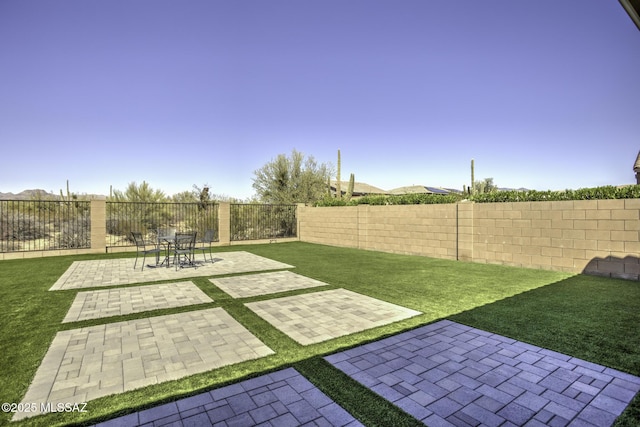 5854 W Indian Sunrise Dr, Tucson, AZ 85742 - view of yard featuring a patio and a fenced backyard