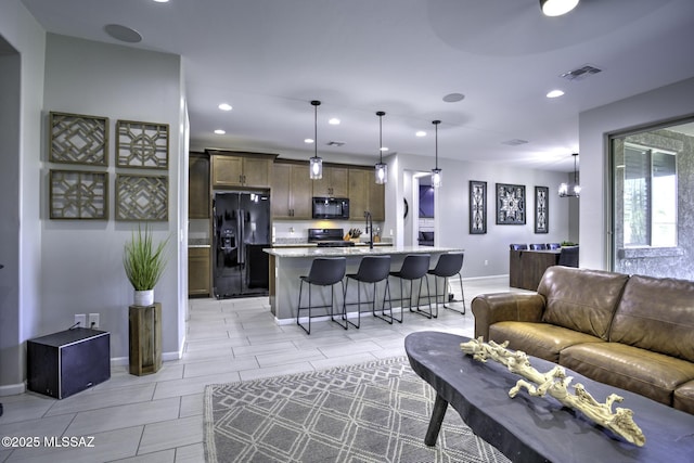 5854 W Indian Sunrise Dr, Tucson, AZ 85742 - living area featuring recessed lighting, baseboards, and visible vents