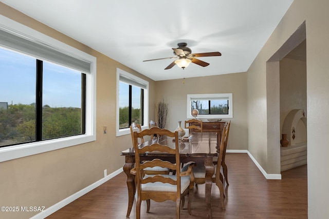5122 W Camino De La Amapola, Tucson, AZ 85745 - dining room featuring dark wood finished floors, ceiling fan, and baseboards
