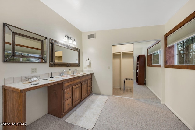 5122 W Camino De La Amapola, Tucson, AZ 85745 - bathroom featuring double vanity and carpet flooring