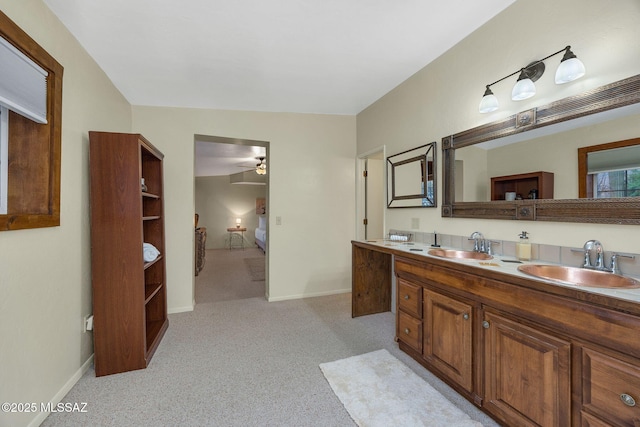 5122 W Camino De La Amapola, Tucson, AZ 85745 - full bath with ensuite bath, ceiling fan, double vanity, and baseboards