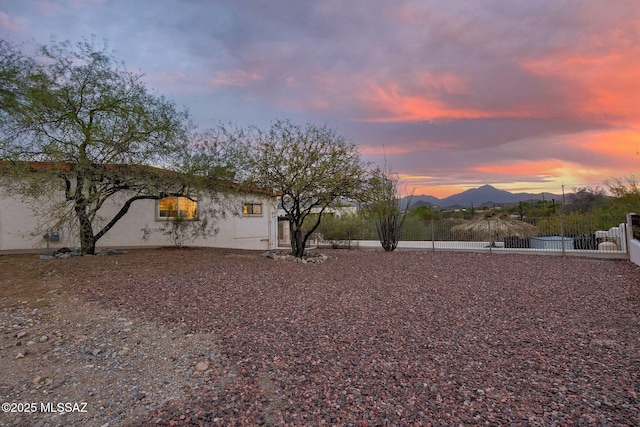 5122 W Camino De La Amapola, Tucson, AZ 85745 - yard at dusk featuring a mountain view
