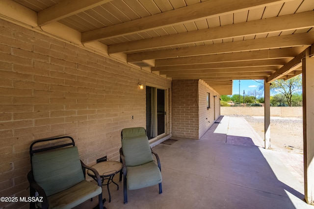 view of patio featuring fence